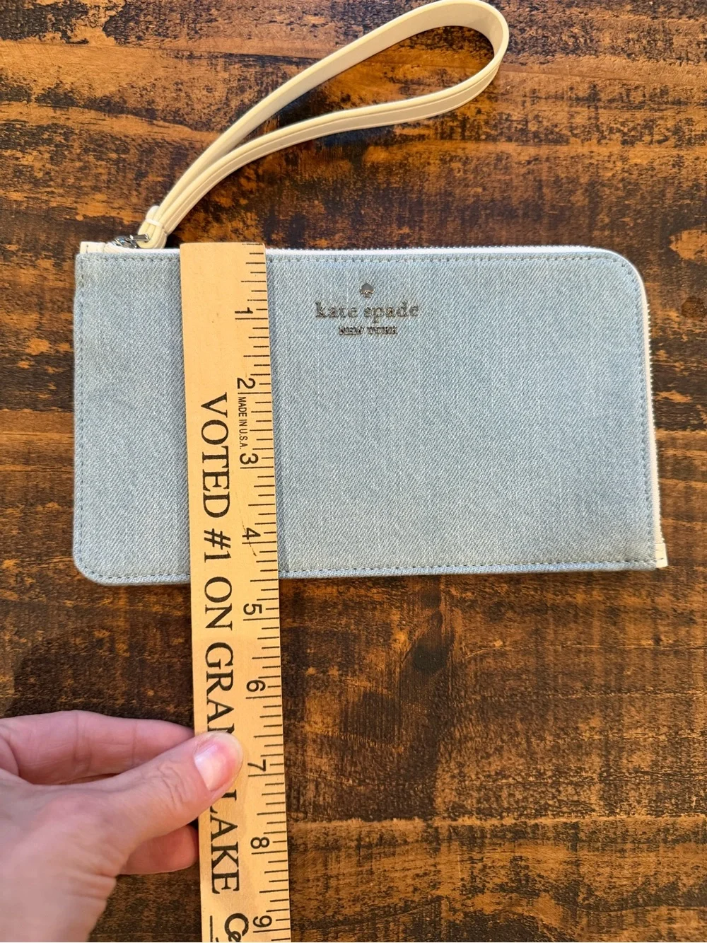 kate spade light denim wristlet with cream strap
